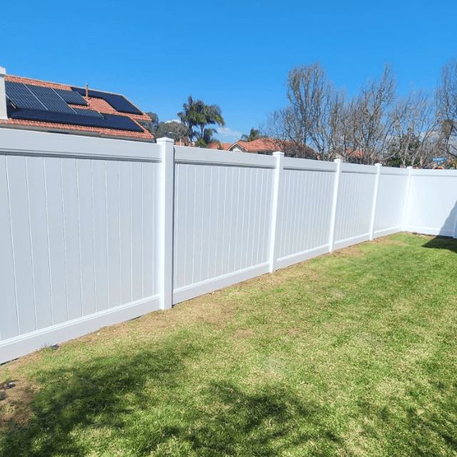 White vinyl privacy fence installed by RG Fencing LLC